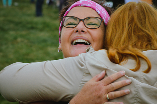 Great North Runner hugging someone after the race